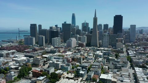 view of San Francisco skyline flying backward revealing Coit Tower