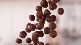 Chocolate Ball-Shaped Cereals Falling Down in a Batch in Slow Motion and Macro - Powered by Shutterstock - Get 15% off with code: PIKWIZARD15