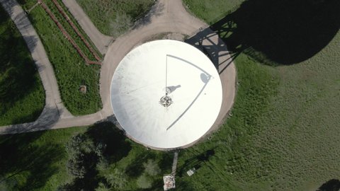 Aerial view of large telecommunications antenna or Radio telescope satellite dish. High quality 4k footage