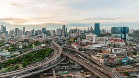 Time-lapse day to night,Of traffic on city streets at twilight, Timelapse of Bangkok Road roundabout with car Beautiful landmark in Business downtown in Thailand. Public transport Business District 