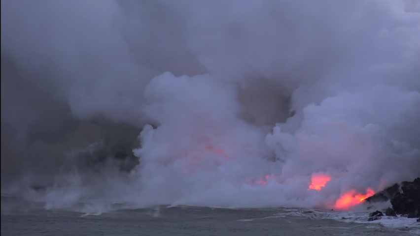 Lava flows into the ocean, Timelapse. Kilauea Volcano, Hawaii Big Island, USA.