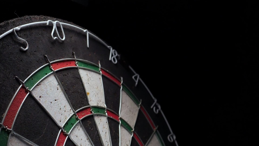 Three darts hit the tripling of sector 20 on the Dartboard. 180 points with three darts.  Royalty-Free Stock Footage #1072237376