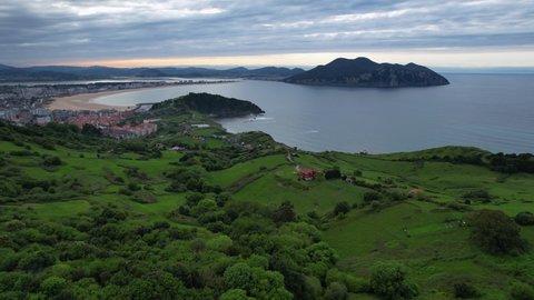In the background Mount Buciero in the Santoña, Victoria and Joyel Marshes Natural Park. Aerial view from a drone of the coastal landscape between Liendo and Laredo along the Valverde trail. 