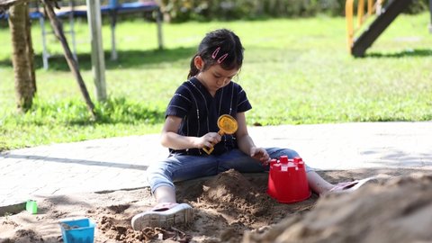Asian kindergarten play toys at playground sand for pre-school aged children. Sandbox has been a firm playground favorite for generations of children.