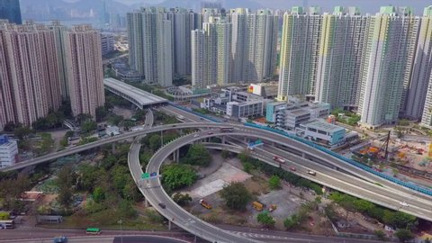 Aerial Shot Of Vehicles On Bridge Amidst Tall Residential Towers, Drone Flying Forward Towards Apartment Buildings In City - Hong Kong, China