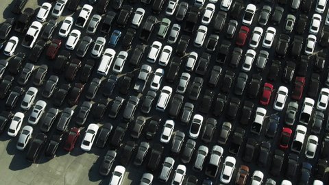 Aerial Top View Of Cars At Parking Lot On Sunny Day, Drone Flying Forward Over Vehicles At Sports Venue - Los Angeles, California