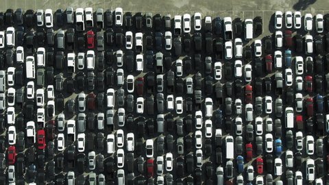 Aerial Top View Of Cars At Parking Lot On Sunny Day, Drone Flying Backward Over Vehicles At Famous Sports Venue - Los Angeles, California