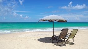 Phuket Thailand. 4K Professional Video Beach and Seascape in sunny day shot. Relaxing seat and chair on beach sand.