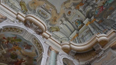 Turin, Piedmont, Italy. May 2021. Footage with rotation of the enchanting ceilings of the queen's villa: the frescoes have bright and vivid colors.