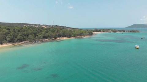 M'pai Bay paradisiac landscape with lush vegetation and crystal clear sea in Koh Rong Sanloem Island, Cambodia - Aerial Panoramic shot