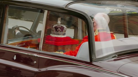 LONDON, 11 MAY 2021 - The Royal Crown is carried to the official state car after Queen Elizabeth II conducted the 2021 State Opening of Parliament, a ceremony dating back to the 16th century
