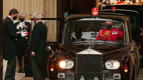 LONDON, 11 MAY 2021 - The Royal Crown is carried to the official state car under the watchful eye of the Lady Usher of the Black Rod after the 2021 State Opening of Parliament