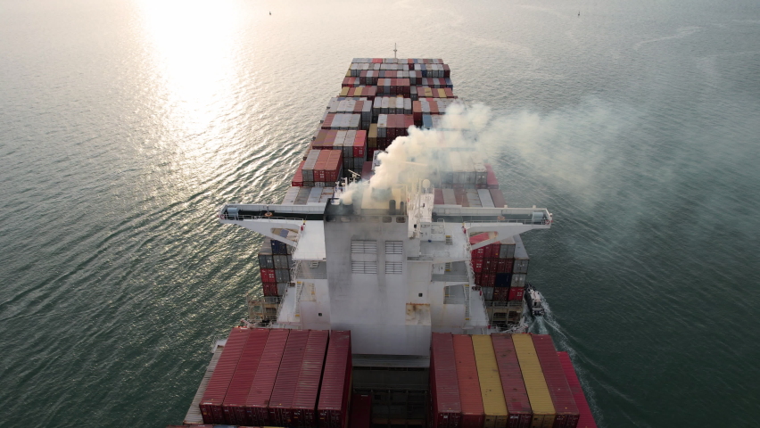 Smoke exhaust gas emissions from cargo lagre ship ,Marine diesel engine exhaust gas from combustion, Gas Emission Air Pollution from transportation. | Shutterstock HD Video #1072307678