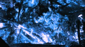 The abstract blue flames of fire. Burning Logs On Fireplace Close Up. Slow motion - Powered by Shutterstock - Get 15% off with code: PIKWIZARD15