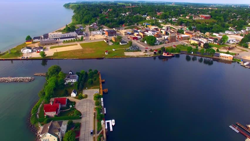 Aerial View of Kewaunee Wisconsin Harbor, Scenic Waterfront, Peninsula, Lighthouse.
