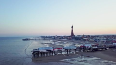 Aerial view, drone footage, of Blackpool Tower from the sky on a beautiful spring morning on one of Great Britains most popular holiday destinations, tourist attractions by the seaside