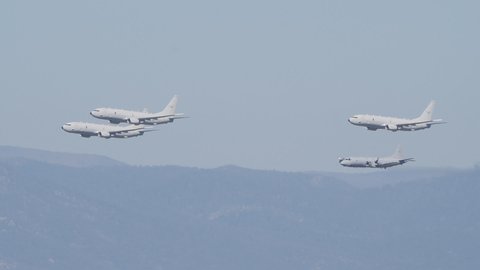 CANBERRA, AUSTRALIA - MARCH, 31, 2021: slow motion tracking clip of RAAF P-8A Poseidon and AP-3C Orion aircraft during the centenary flypast