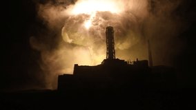 Creative artwork decoration. Chernobyl nuclear power plant at night. Layout of abandoned Chernobyl station after nuclear reactor explosion. Selective focus - Powered by Shutterstock - Get 15% off with code: PIKWIZARD15