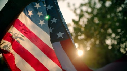 Cinematic American Flag, Stars And Stripes Blowing In Slow Motion, Sunset