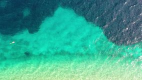 Aerial view on the beach. Vacation and adventure. Beach and blue water. Top view from drone at beach and blue sea. Travel and vacation video.
