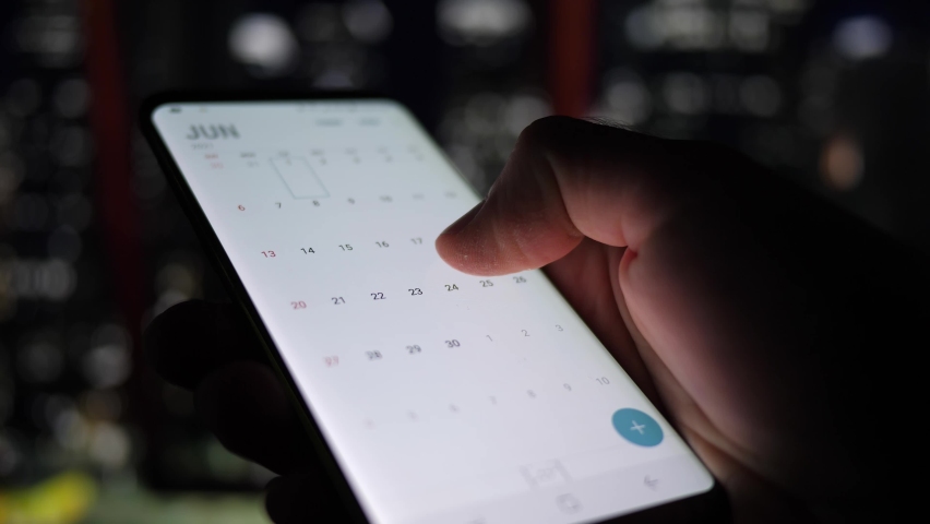 The smart phone browsing the calendar app looking for dates