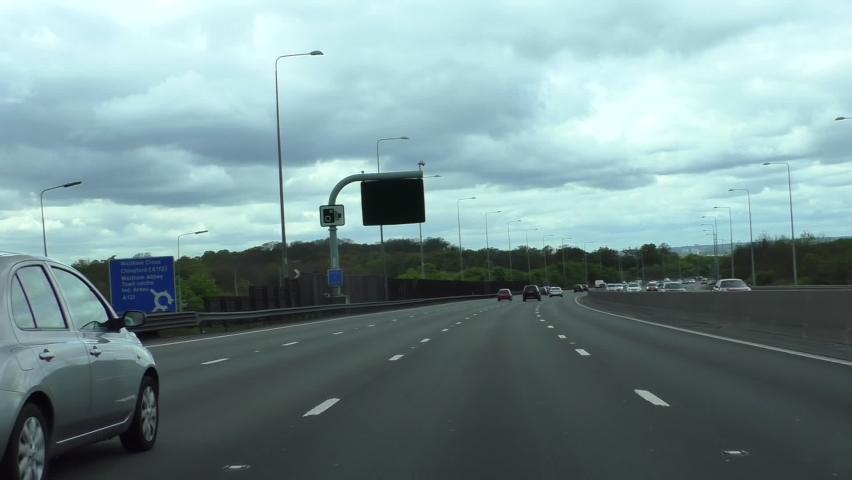 Car point of view, POV driving on London Orbital Motorway M25 anticlockwise at junction, J26. Royalty-Free Stock Footage #1072369802