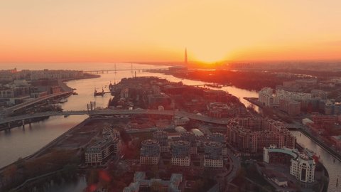 The Russian Venice, Aerial footage of water area of Saint Petersburg, Russia at evening, Flight over the river and bridges at sunset, cityscape in dusk, skyscraper on background, real estate