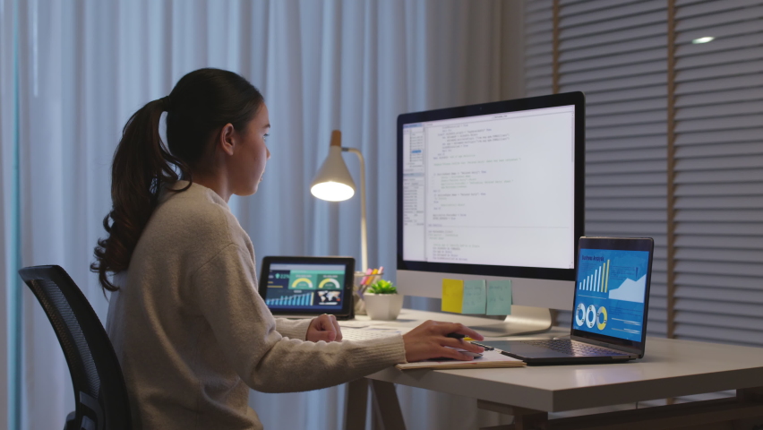 Back view young asia female people analyst coder code language multiple screen cloud online computing ai deep tech work at home office late night reskill upskill, future agile cyber ux web design job. | Shutterstock HD Video #1072382018