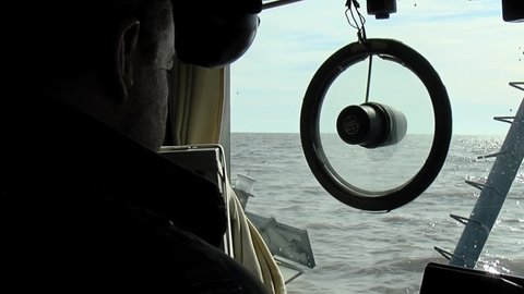 Buenos Aires, Argentina - March 2020: A Buoy Being towed to Installation Site in the Rio de la Plata River, near Buenos Aires, Argentina, South America. View from Captain Cabin.