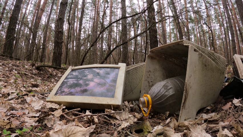 Old computer in a junkyard in the forest, slow motion Royalty-Free Stock Footage #1072388354