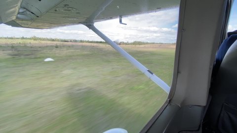 Window view from Cessna aircraft landing in the aerodrome in Lithuania