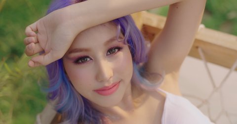 Soft Focus Slow Motion Shot. Beautiful Asian Woman With Magnificent Galaxy Hair Style. New Trend Rainbow Or Unicorn Haircut.
