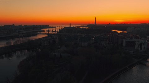 The Russian Venice, Aerial footage of center of Saint Petersburg, Russia at evening, Flight over the river and drawbridges at sunset, cityscape in dusk, skyscraper on background, 