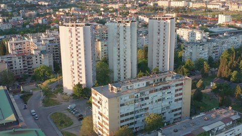 Apartment buildings in a residential urban district of a big city. High-rise multi-story tower blocks with multiple dwelling units as a subsidized housing project in Podgorica, Montenegro, Europe.