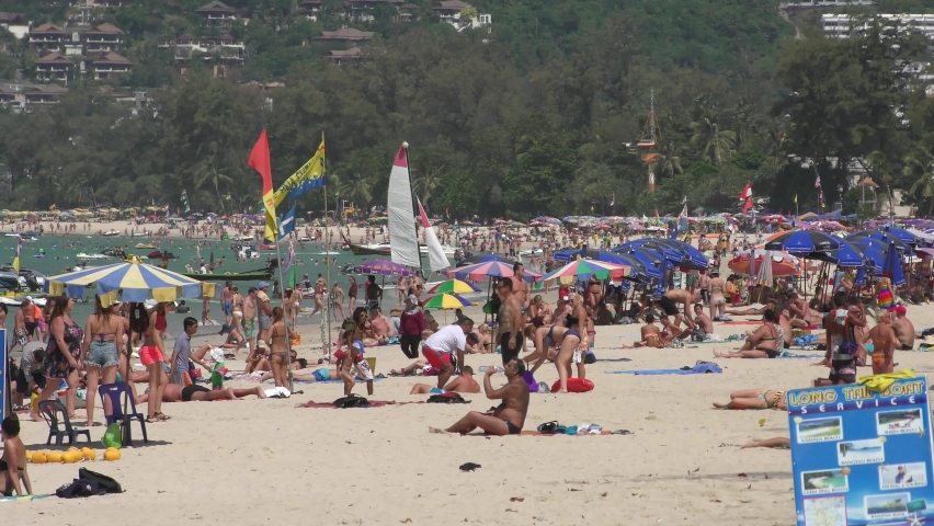 Patong Beach, Phuket - Thailand - January 3 2016 - The Way It Was. A Crowded Patong Beach in Phuket, Thailand before the 2020 coronavirus ended travel and tourism as we knew it.