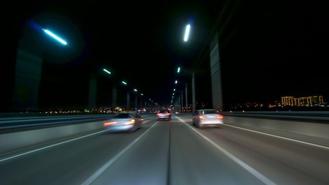 High Speed On The Night Road Fast Car Hyperlapse Car Driving Through City Trip Travel Concept. Freedom on the Road Sort of Dashcam POV