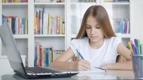 Kid Studying on Laptop in Coronavirus Pandemic, Child Learning, Writing Home, Schoolgirl Teenager Homeschooling, Online Education