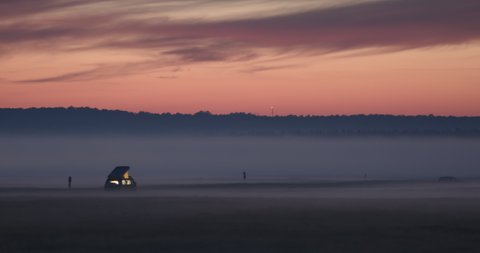 Sunset With Campers in Fog