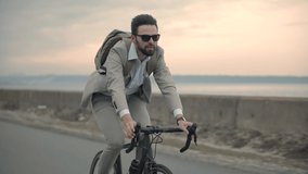 Businessman In Suit Riding On Bicycle. Trip To Work On Bike. Cyclist Businessman Hurry To Work. Traffic Jam In City. Commuter Healthy Lifestyle On Bike. Travelling On Office. Lose No Time In Rush Hour - Powered by Shutterstock - Get 15% off with code: PIKWIZARD15