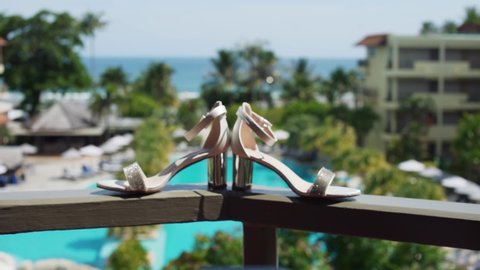 hotel, accessories, beautiful, bouquet, bride, close-up, decoration, girl, hotel lobby, jeweled sandals, married, no people, outdoor, pair of shoes, resort, shoe, sitting, wedding shoes, white, woman
