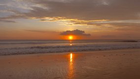 Professional 4K Video. Scene of Sunset on tropical beach sea. New normal after covid-19. Phuket Thailand beautiful tropical beach with a sunset sky. Beautiful Phuket beach in Andaman sea sunset.