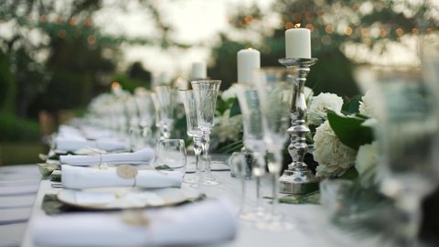 Wedding decor bouquet candle dinner. tablecloth catering, celebration, dining room, festive, fire, flower, glasses, light, merry Christmas, party, reception, romantic, setting. copy space 2022.