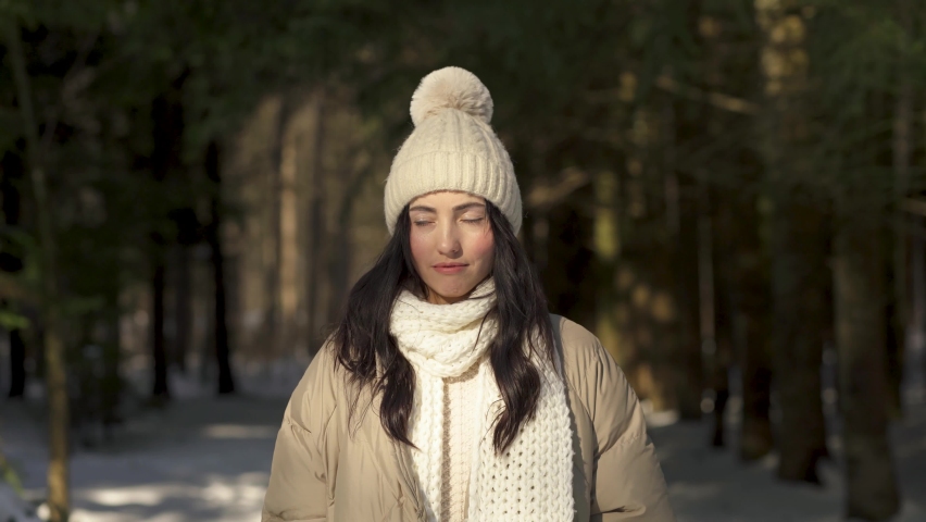 Girl model posing in winter in the woods.