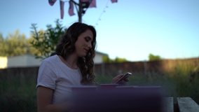 A young Spanish woman drinking in the park shot in 4K