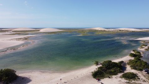 Jericoacoara Beach, Ceará, Brazil. Panorama landscape of natural park with beauty sand dunes mountain. Aerial view of paradise beach scenery. Seascape beach of Jericoacoara, Ceara, Brazil.