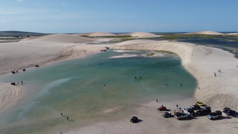 Jericoacoara Beach, Ceará, Brazil. Panorama landscape of natural park with beauty sand dunes mountain. Aerial view of paradise beach scenery. Seascape beach of Jericoacoara, Ceara, Brazil.