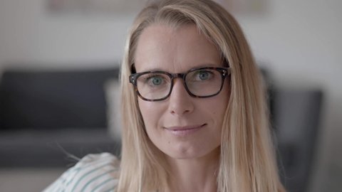 Portrait of attractive blond woman with eyeglasses 