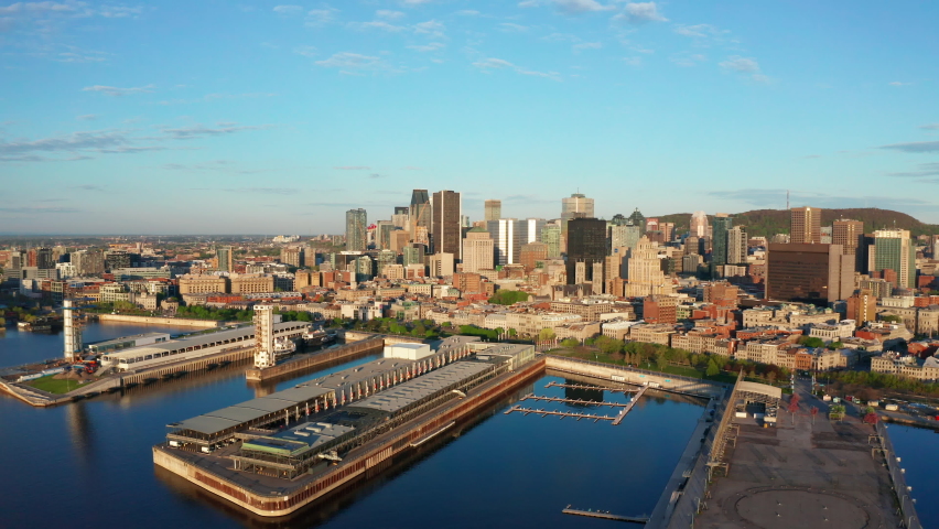 Aerial Drone of Downtown Montreal  on Sunny Day. Camera Pushes In to the Old Port of the City Centre in Quebec's Capital
