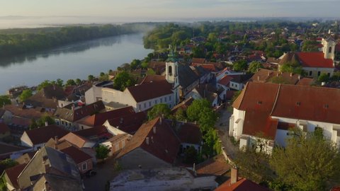 Splendid aerial cityscape footage about Szentendre in Hungary. Amazing little old town near by Budapest. There are beautiful old colorful houses in downtown