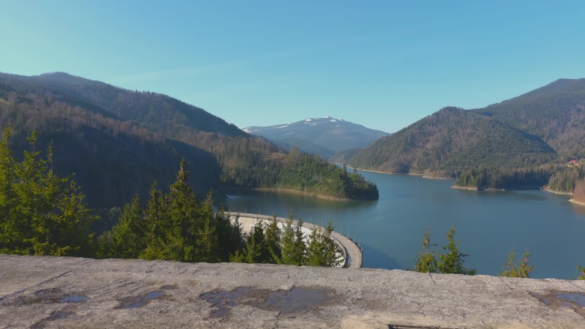Water Dam Between Mountains From Above Summer Sunny Day Bridge